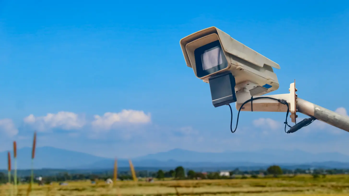 surveillance-camera-metal-rail-with-blurred-fields